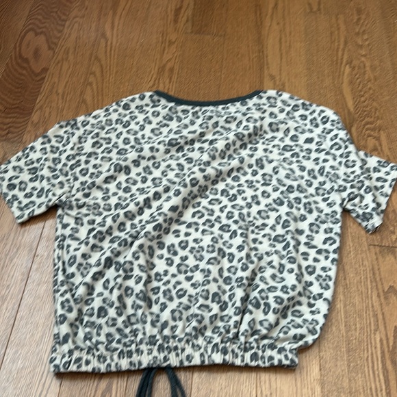 This shirt is a Cheetah print shirt with a scrunch on the bottom of it - Picture 2 of 2